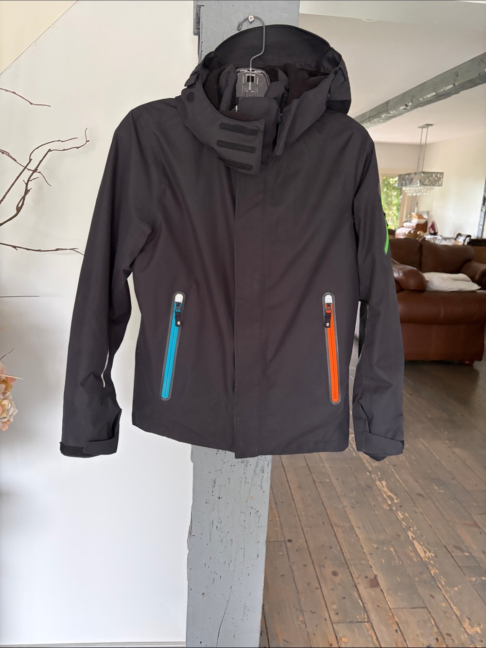 Kids Black Hooded Ski Jacket with Bright Blue & Orange Zip Accents ski jacket
